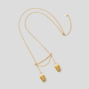 gold precious buckets necklace on white background
