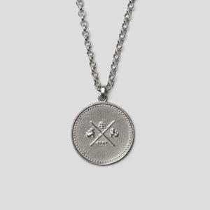 back of Silver precious coin necklace on white background