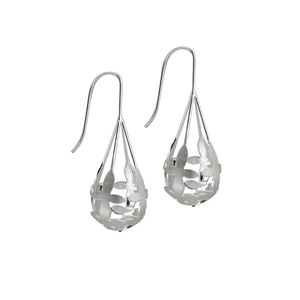 Side view of Brave Edith Thanaka Leaf Drop earrings in sterling silver on white background