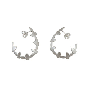 Side view of Brave Edith Thanaka Leaf Hoop Studs in sterling silver on white background