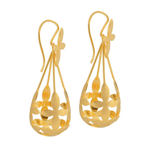 Side view of Brave Edith Thanaka Leaf Chandelier earrings in gold vermeil