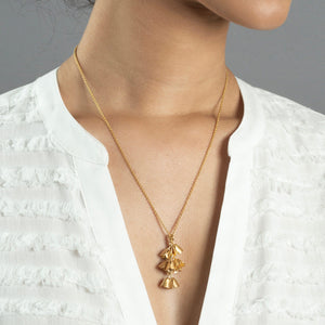woman wearing medium gold padauk necklace