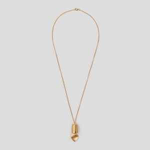 gold precious bell pendant on white background