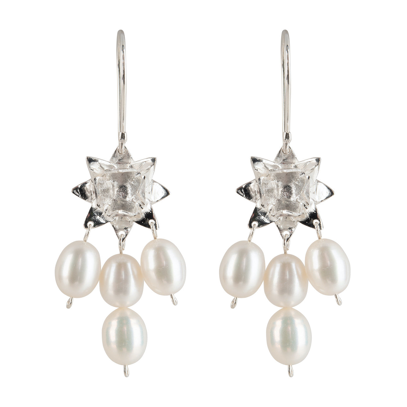 Side view of Lotus Dawn pearl earrings in sterling silver on white background