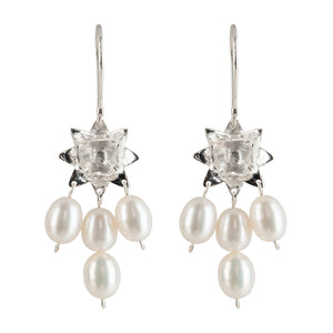 Front view of Lotus Dawn pearl earrings in sterling silver on white background