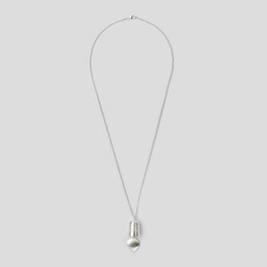 silver precious bell pendant on white background