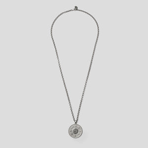 Silver precious coin necklace on white background