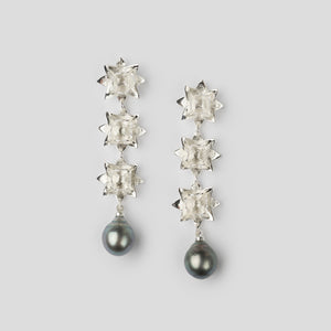 silver triple lotus earrings with Tahitian pearl on white background