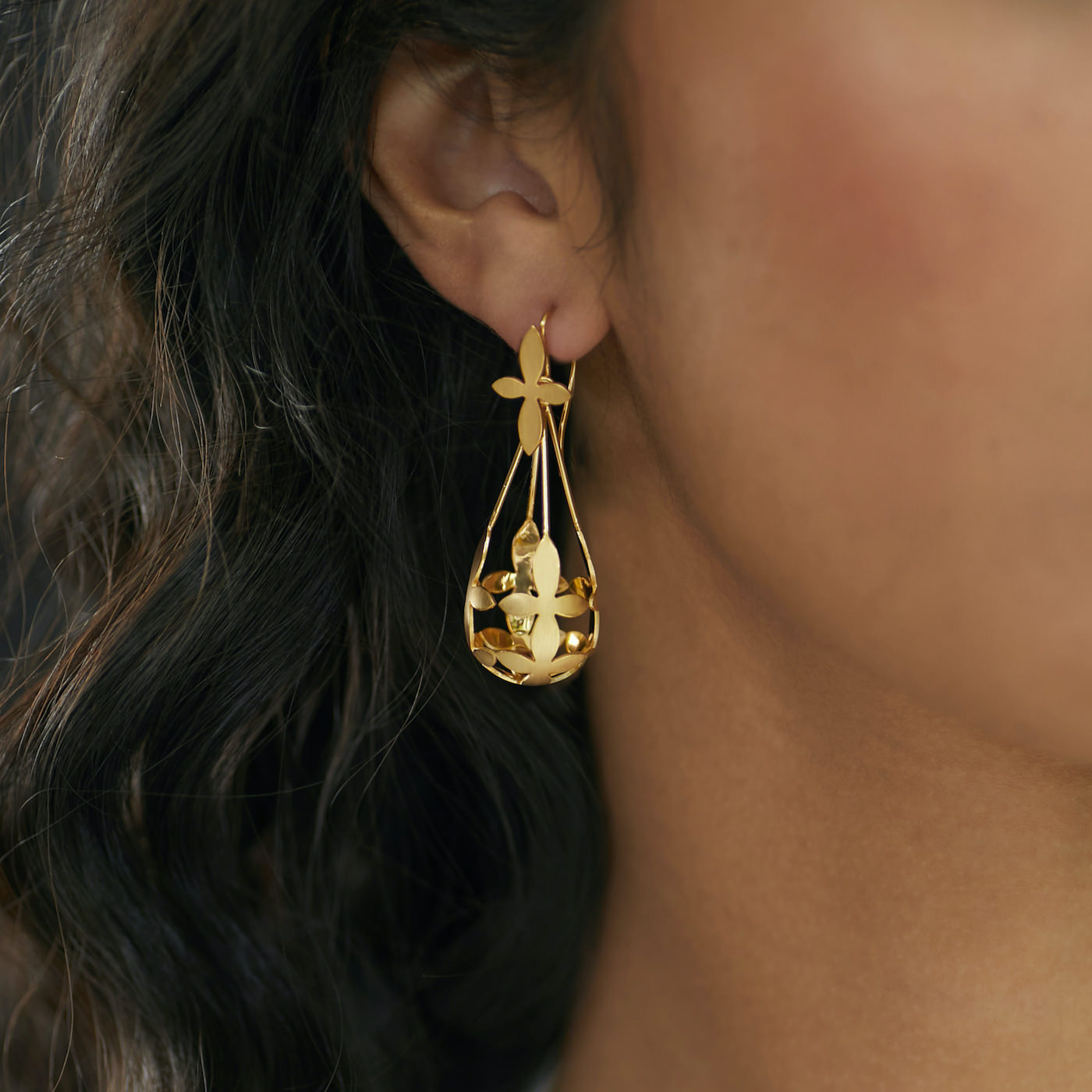 Front view of Brave Edith Thanaka Leaf Chandelier earrings in gold vermeil